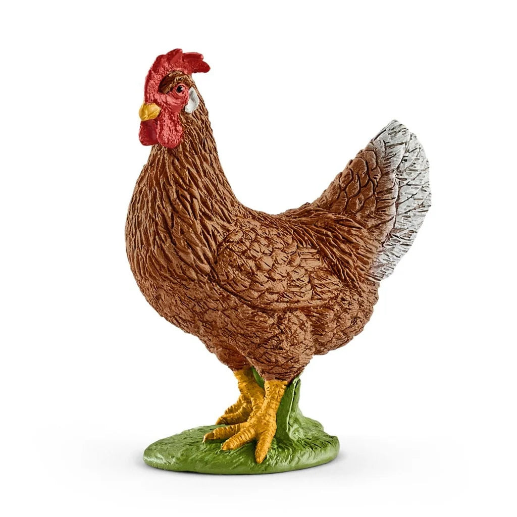 Small figurine of a hen from Schleich on a white background