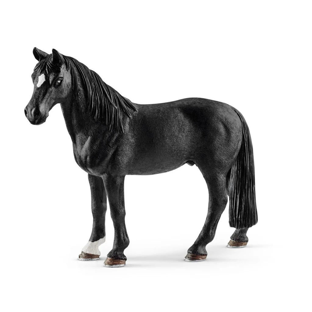 Black Schleich horse figurine on a white background