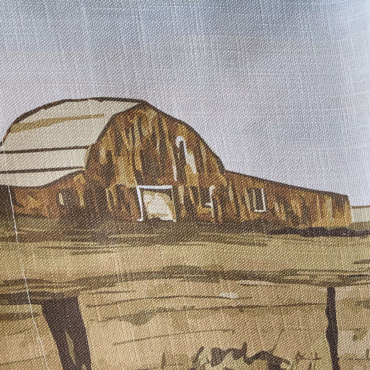 Illustration of a barn on fabric with a textured background