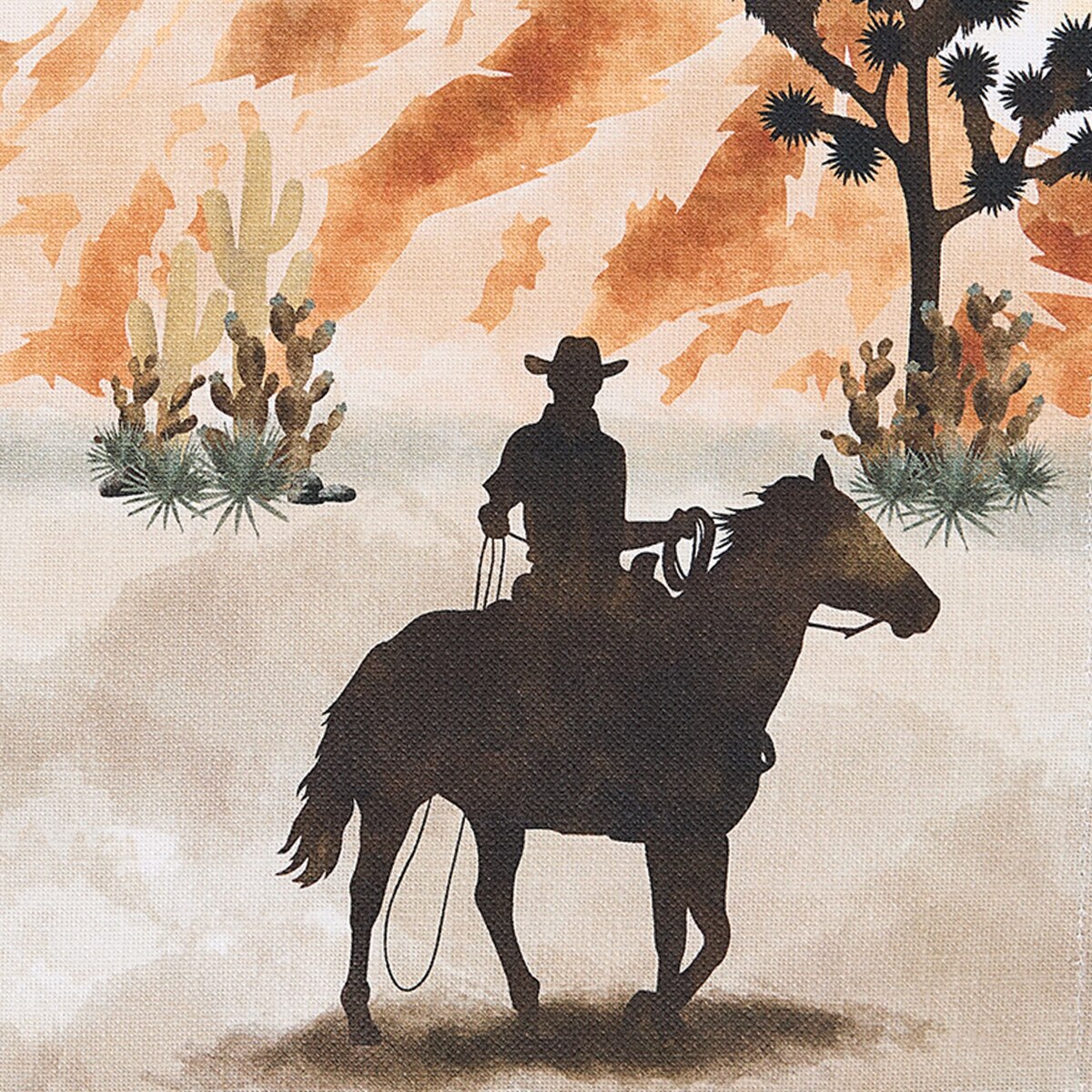 Silhouette of a cowboy on horseback with a desert landscape featuring cacti and mountains.