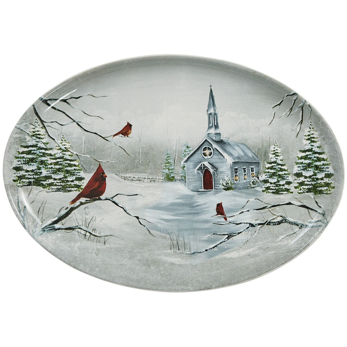 An oval decorative platter from Park Designs featuring a winter landscape scene with a small church, snow-covered evergreen trees, and red cardinals on branches, shown on a plain white background.