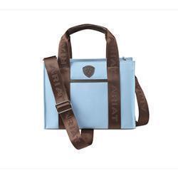 a blue tote bag with brown handle and strap on a white background. Ariat logo on front of bag.