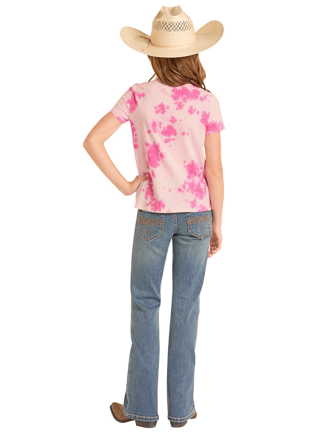 Person wearing a pink tie-dye Rock&Roll Denim shirt and blue jeans with a cowboy hat on a white background
