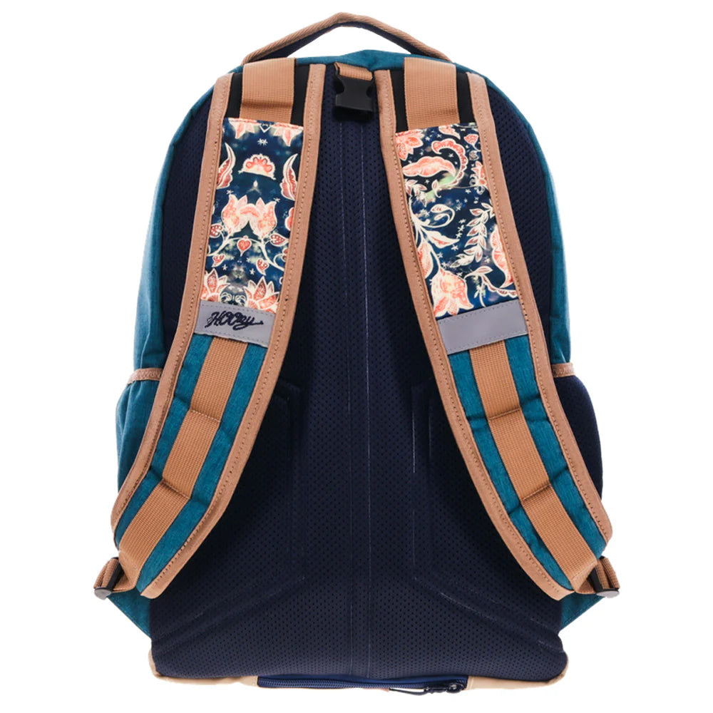 Navy blue Hooey backpack with floral patterned straps on a white background
