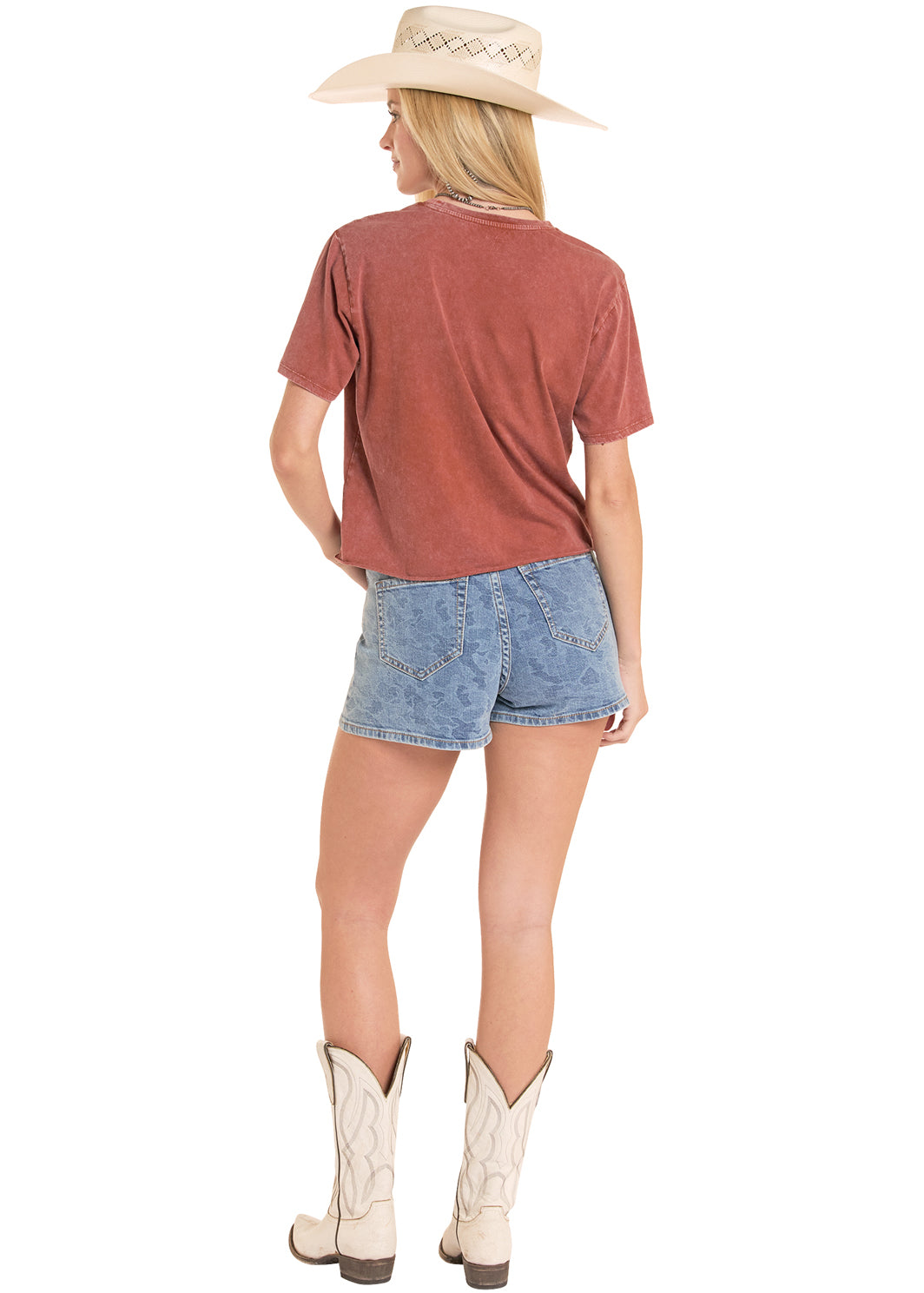 woman wearing a Rock&Roll Denim shirt, jean shorts and a cowboy hat on a white background