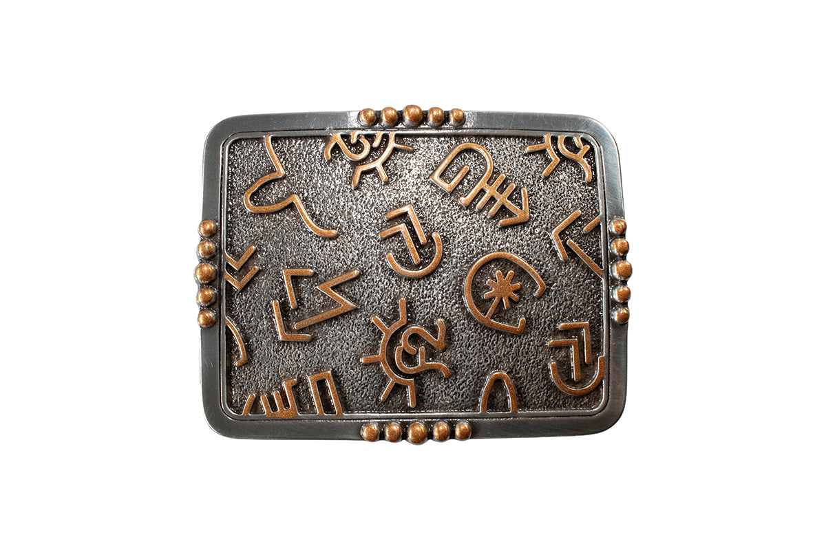 Decorative Blazin Roxx metal belt buckle with engraved symbols on a white background