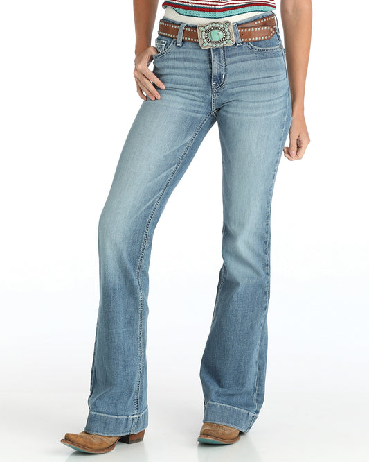Light blue jeans with a decorative belt on a white background