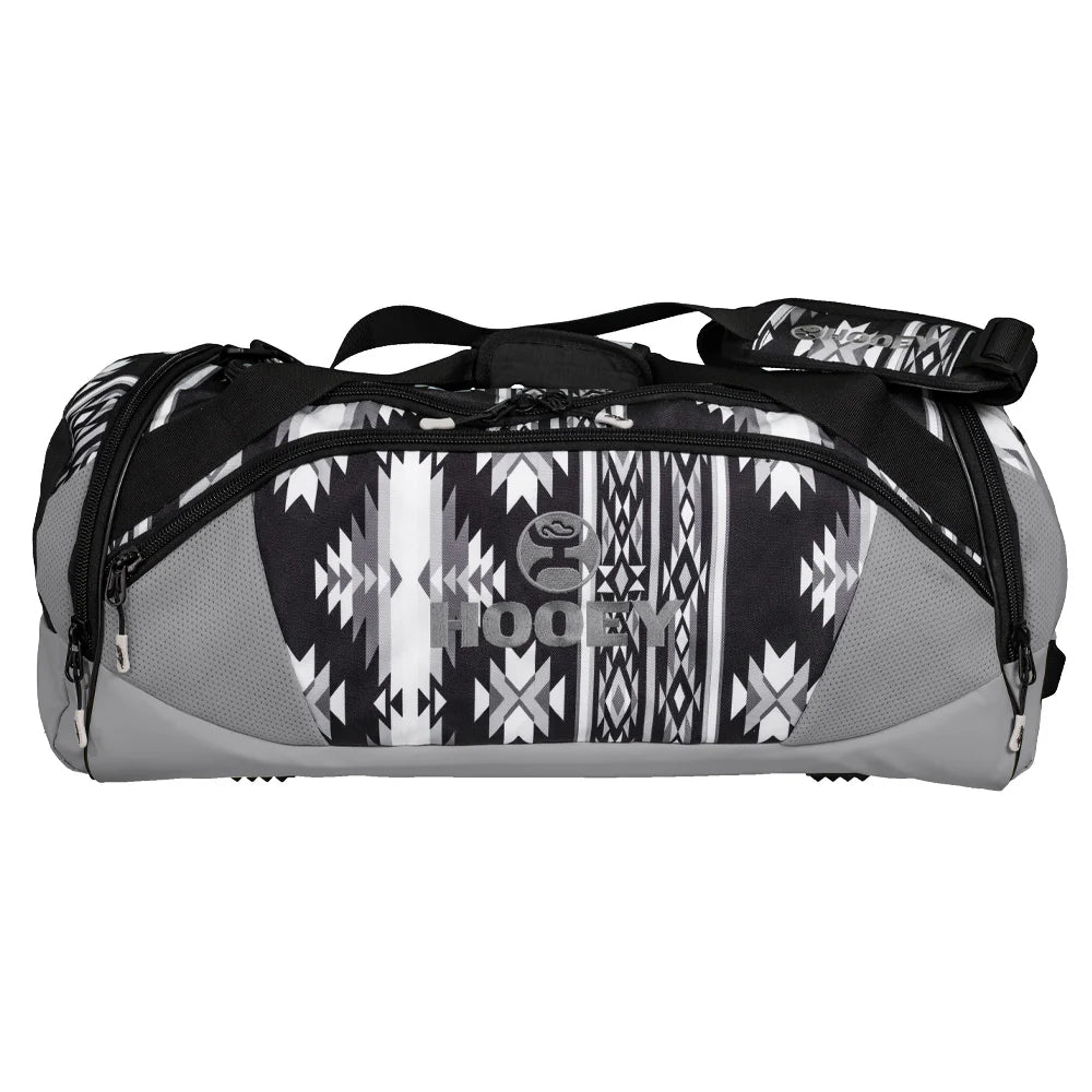 Gray and black duffel bag with aztec pattern and 'Hooley' branding on a white background