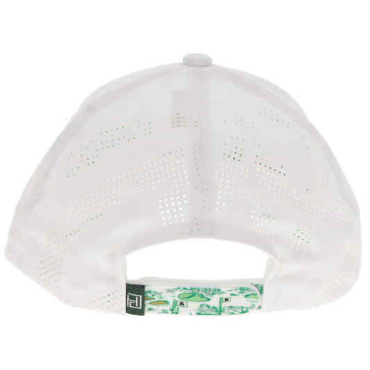 the back of a white cap with laser print mesh and a green pattern on the snap strap