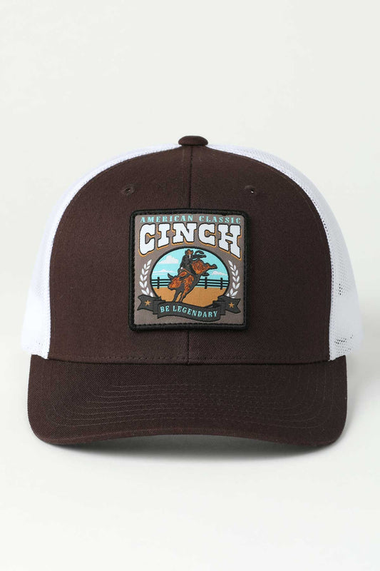 Brown and white cap with Cinch logo on a light gray background