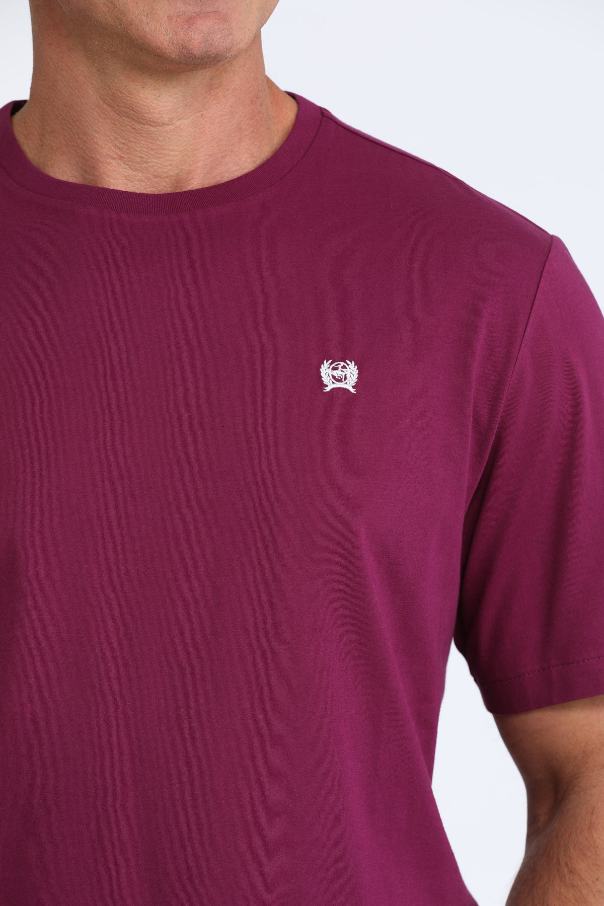 Maroon Cinch t-shirt with a small white logo on a plain background
