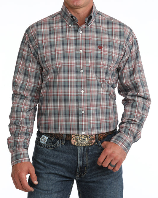Person wearing a plaid Cinch shirt and jeans on a white background
