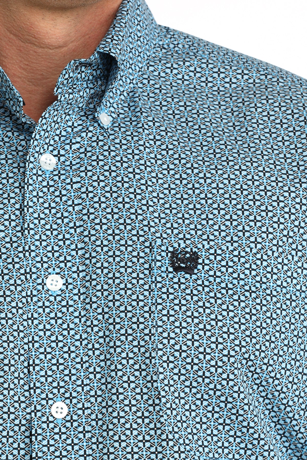 man wearing a blue patterned Cinch shirt on a white background