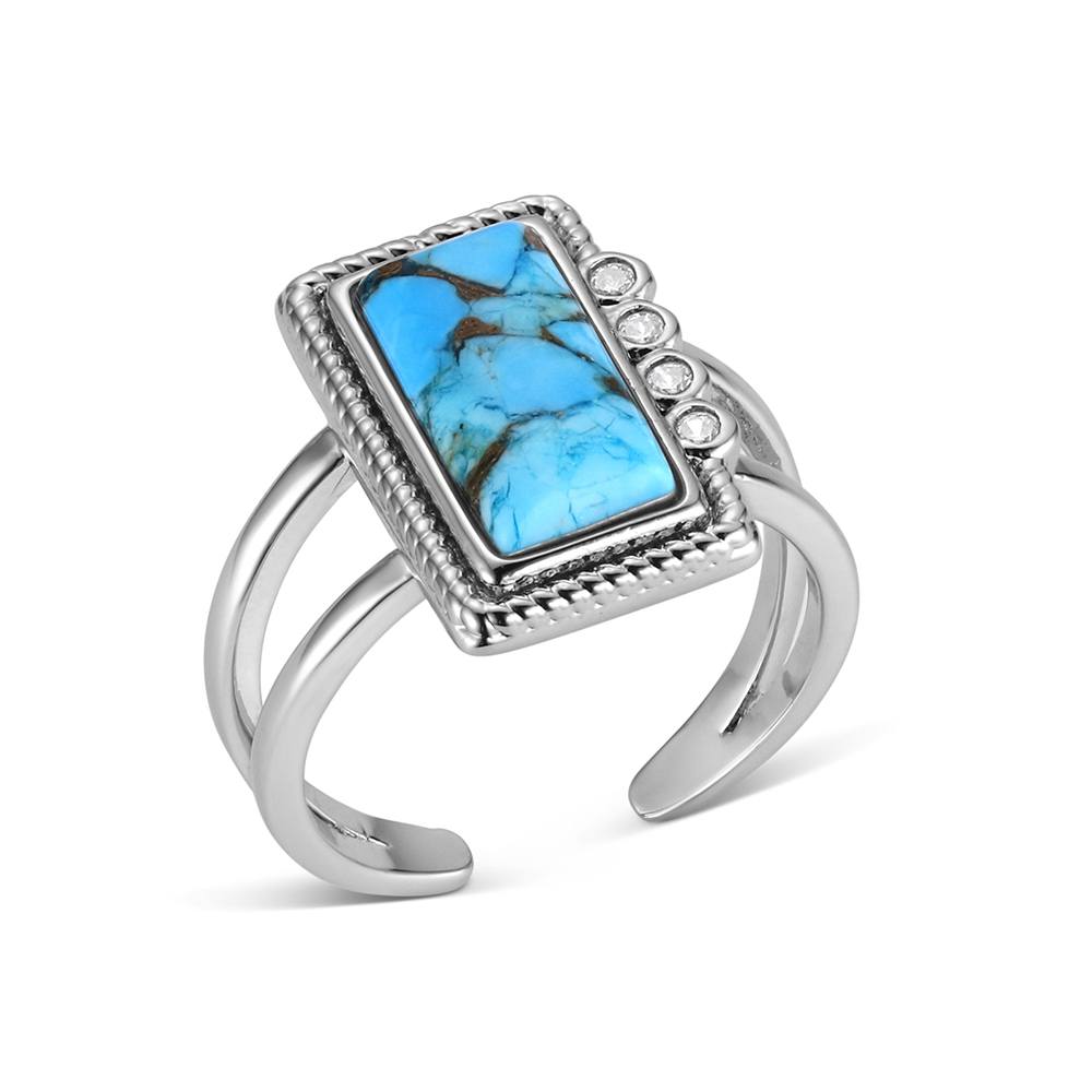 Silver Montana Silversmiths ring with a rectangular turquoise stone on a white background