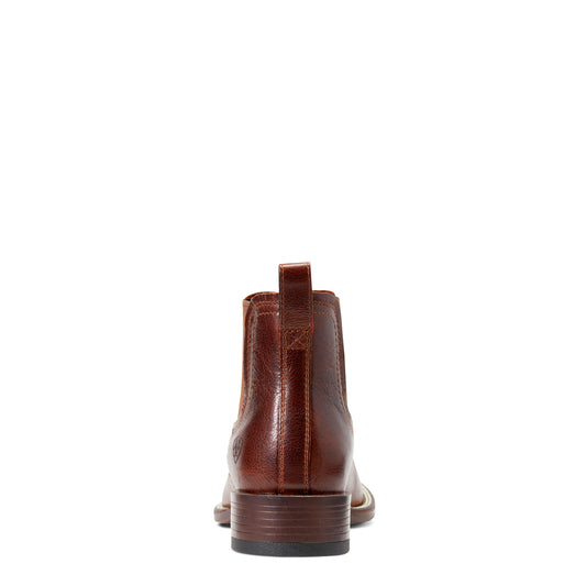 back of a Brown leather boot on a white background