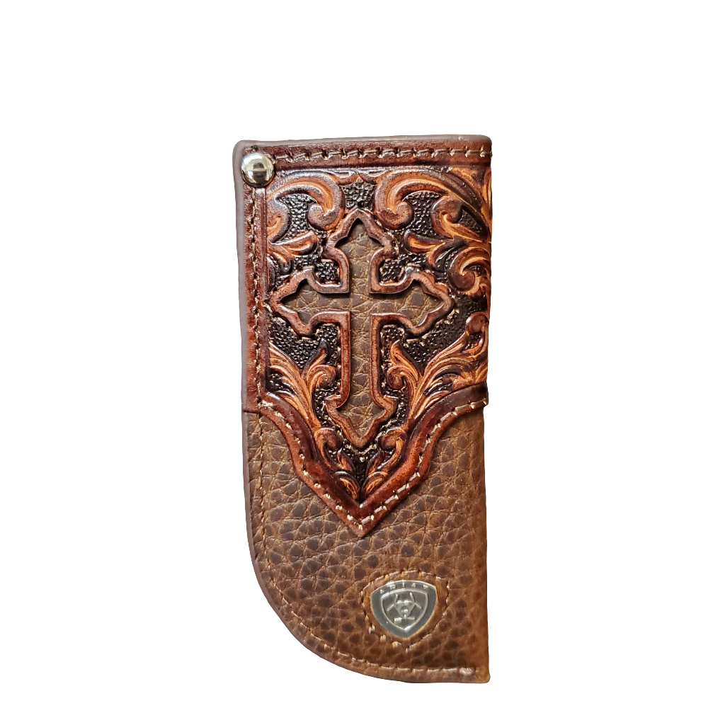 Brown leather knife sheath with intricate embossing on a white background