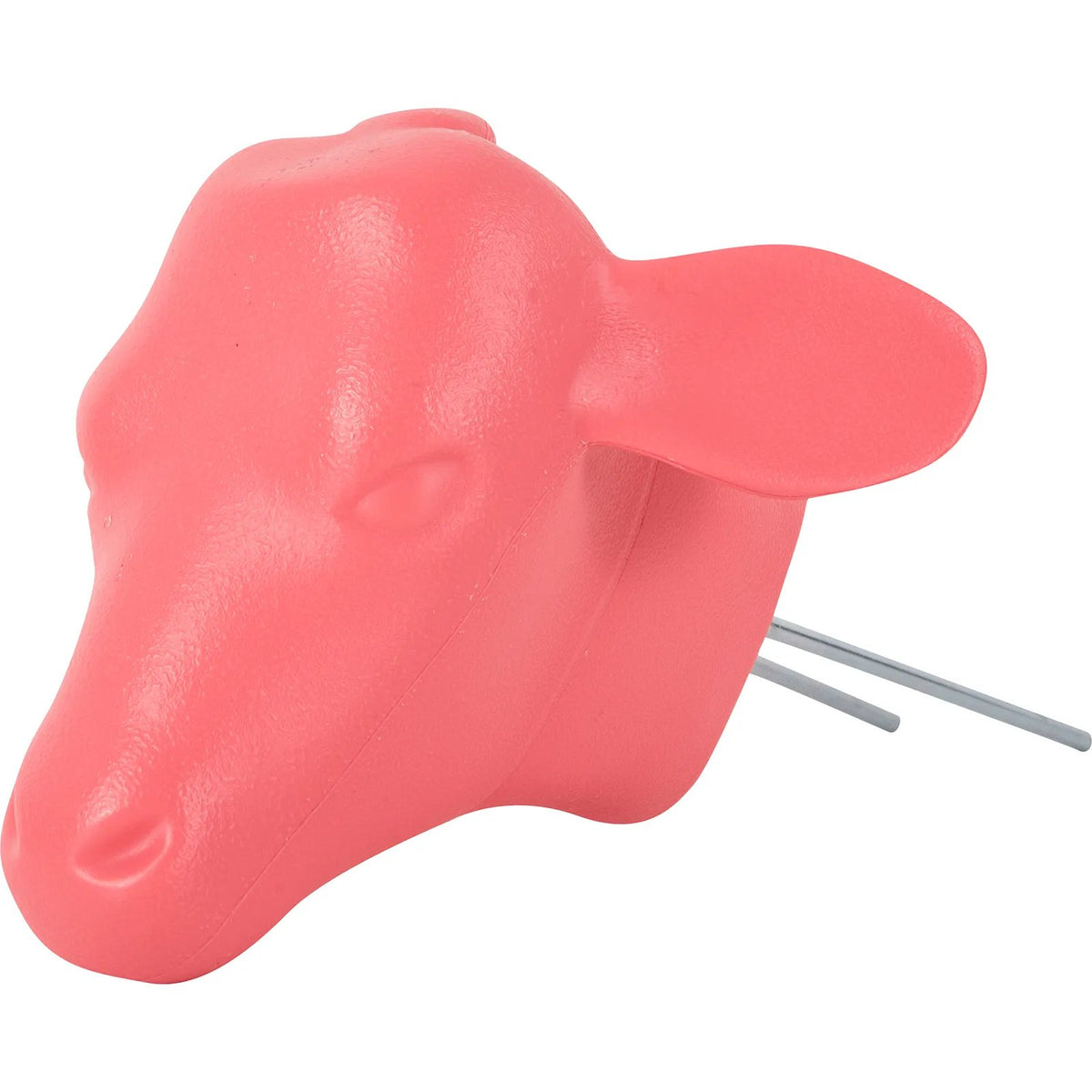 A pink molded plastic calf head with two prongs for use with hay bale in calf roping practice.