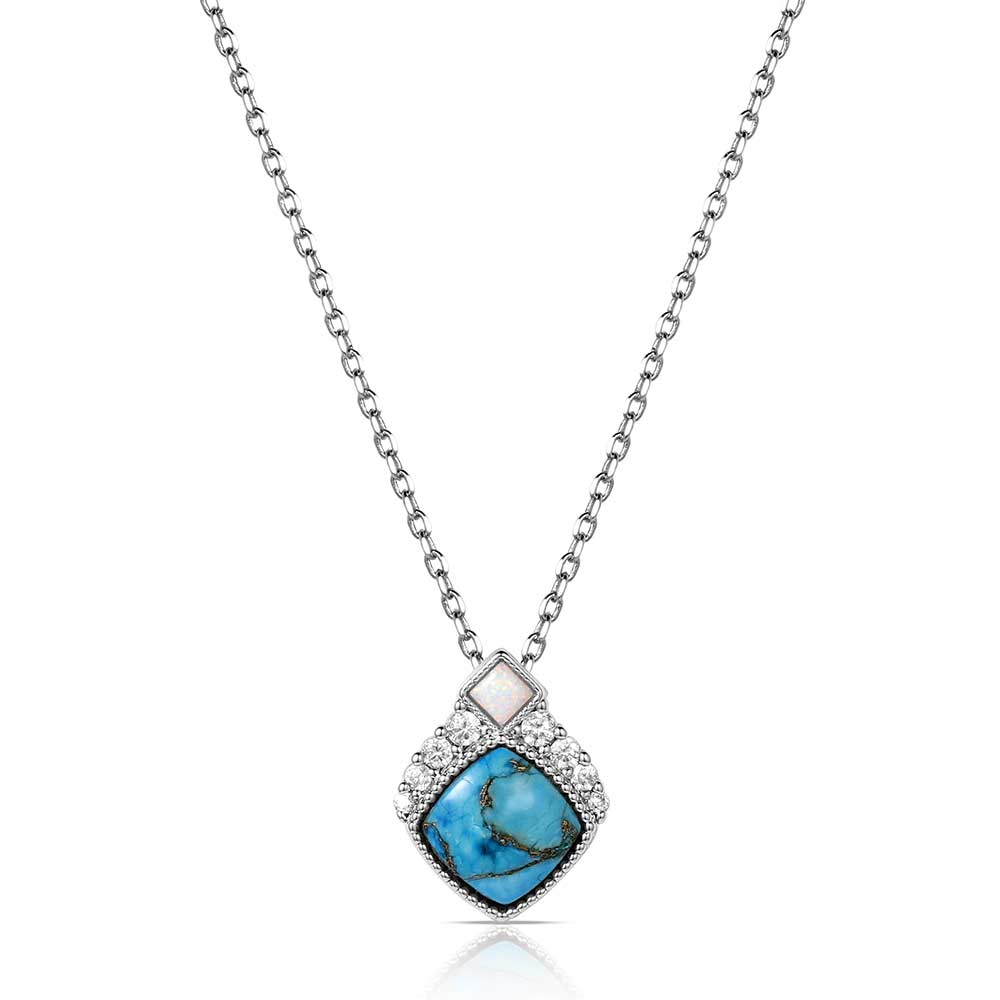 Silver Montana Silversmiths necklace with a turquoise gem on a white background