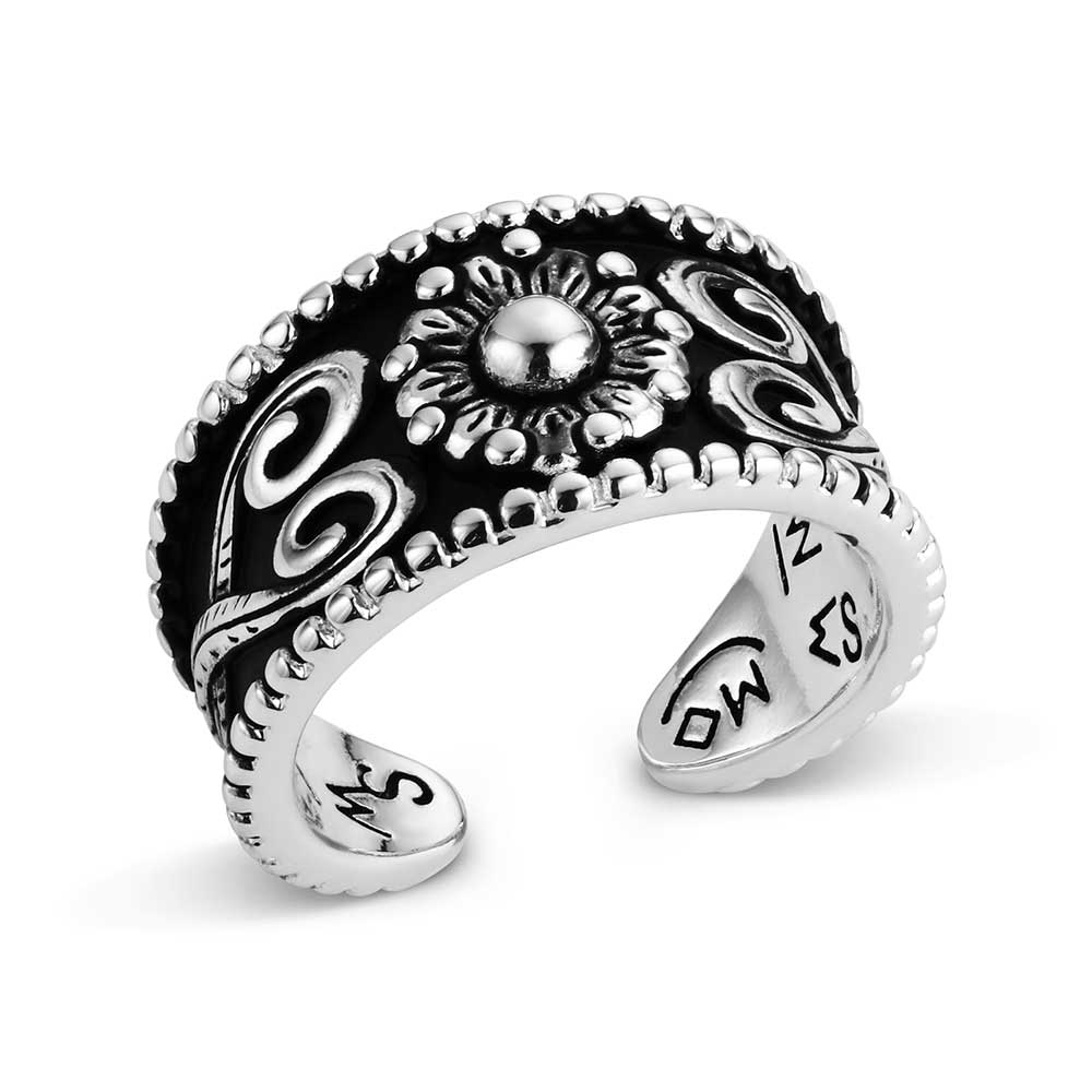 Silver Montana Silversmiths ring with intricate designs on a white background