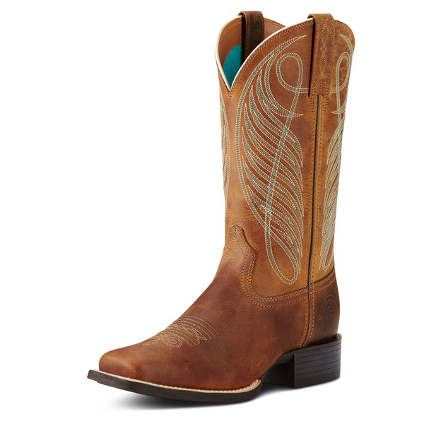 Brown Ariat cowboy boot with intricate white stitching on a white background