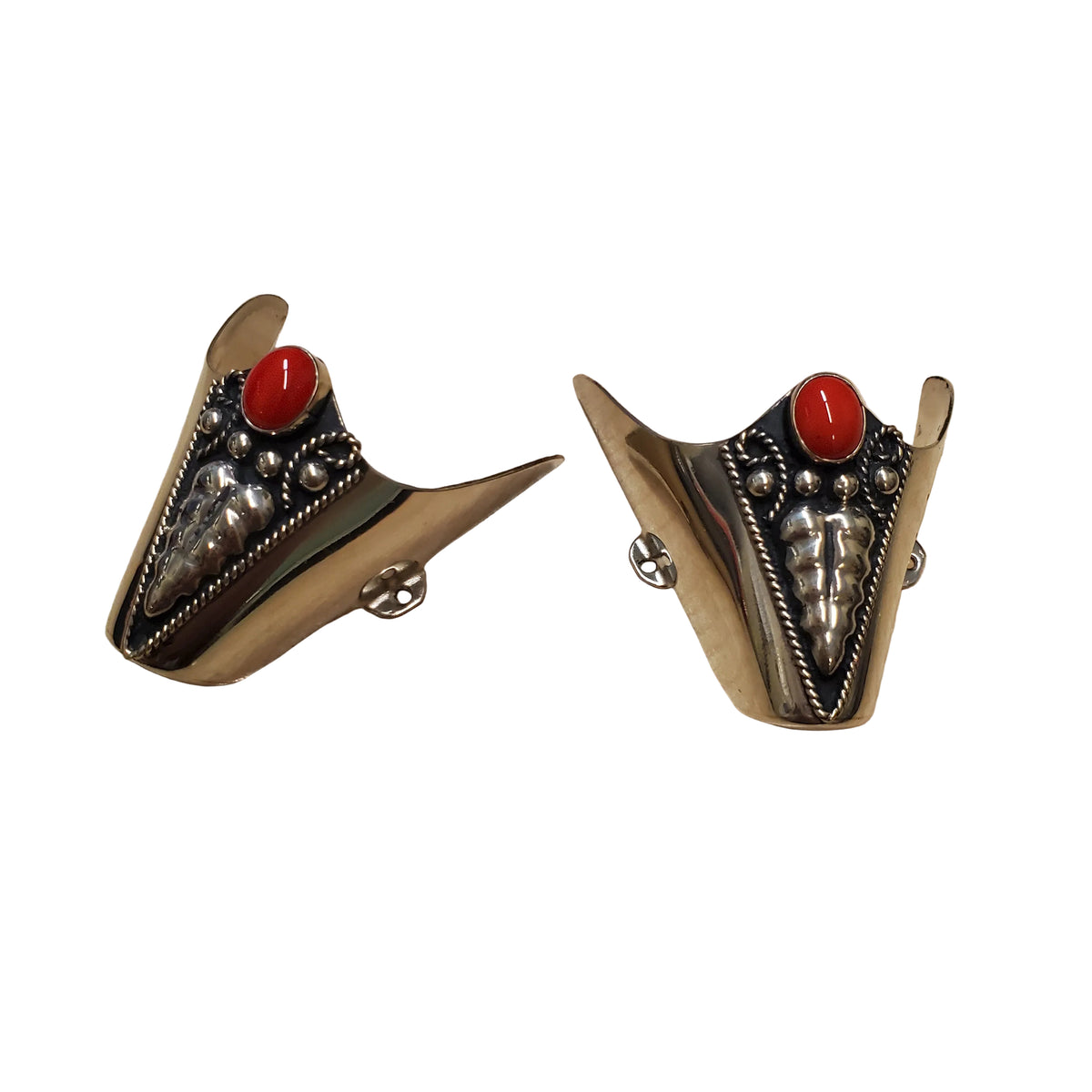 silver boot tips with red stone and overlay detail on a white background