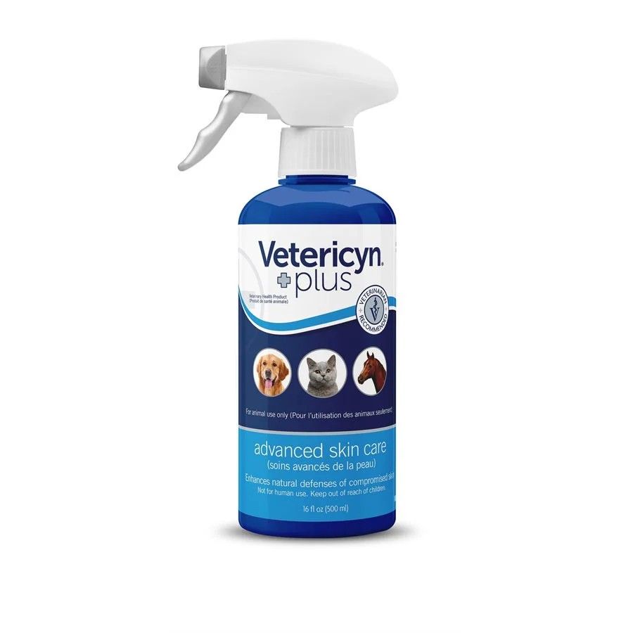 a blue spray bottle containing vetericyn plus advanced skin care with a dog, cat and horse on label