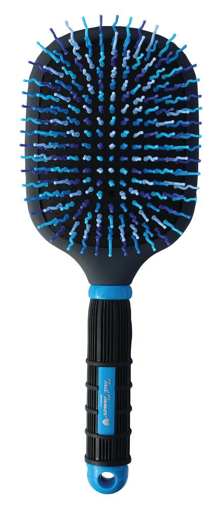A Mod Paddle Brush with a black and blue rubber handle and wavy bristles designed for horse grooming.
