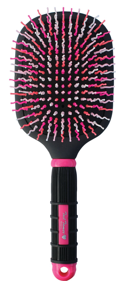 A Mod Paddle Brush with a black and pink rubber handle and wavy bristles designed for horse grooming.