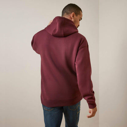 Man wearing a maroon Ariat hoodie from behind on a plain background