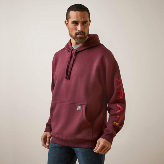 Man wearing a maroon hoodie with 'Ariat' branding on a plain background