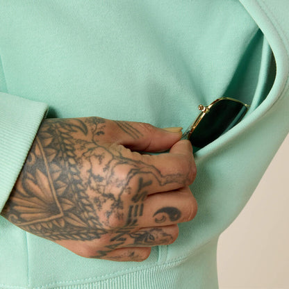 Light Green Ariat hoodie on a grey background