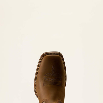Toe of a leather Ariat boot on a white background