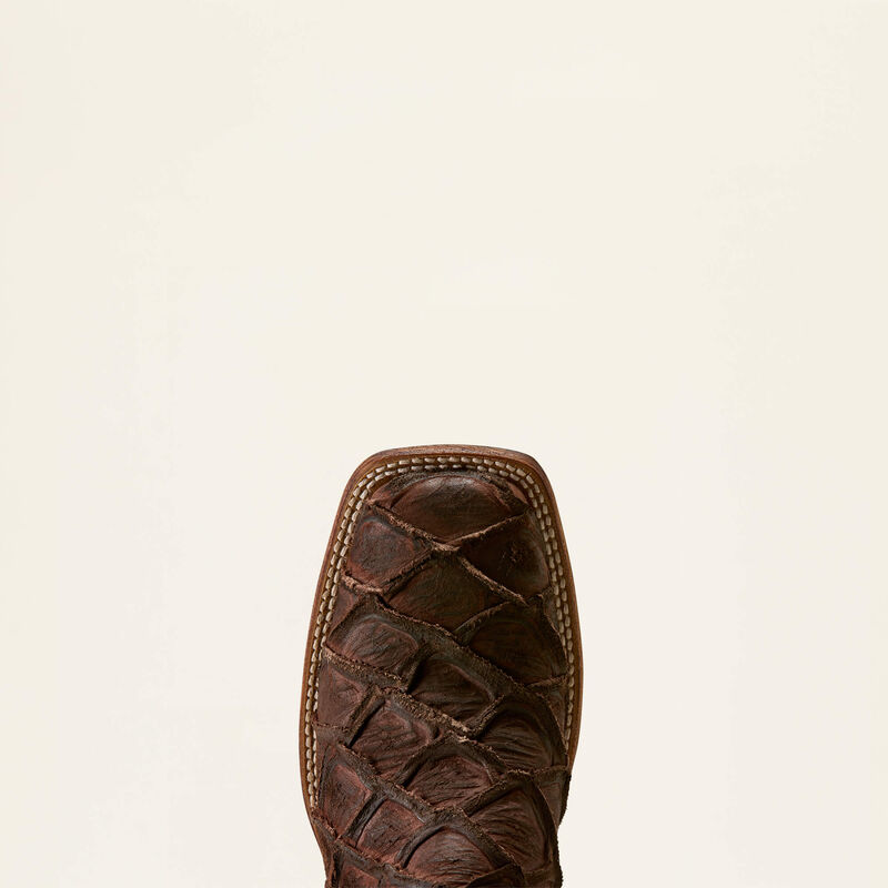 Toe of a leather Ariat boot on a white background