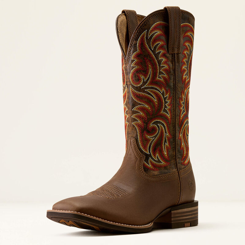 Brown leather Ariat boot with orange stitched design on a white background