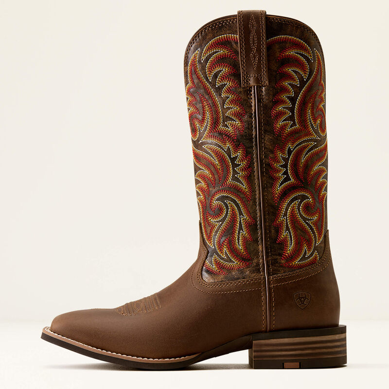 Brown leather Ariat boot with orange stitched design on a white background