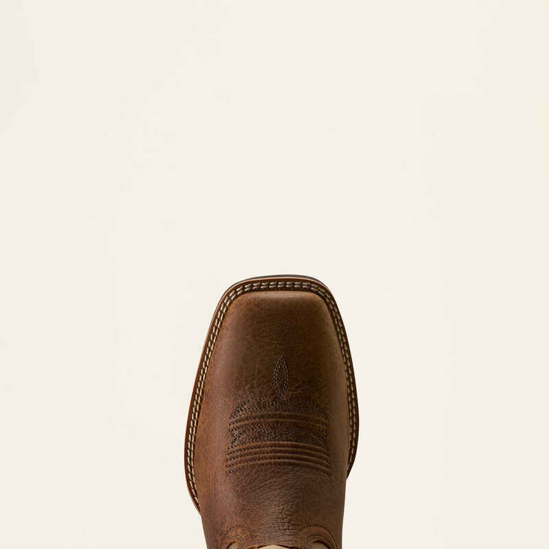 Toe of a brown Arait boot on a white background