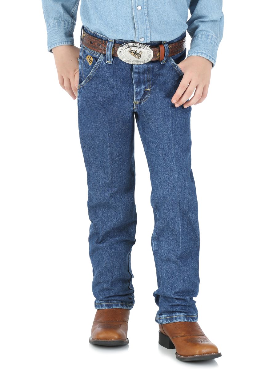 Boy wearing blue jeans, a light blue shirt, and brown boots on a white background