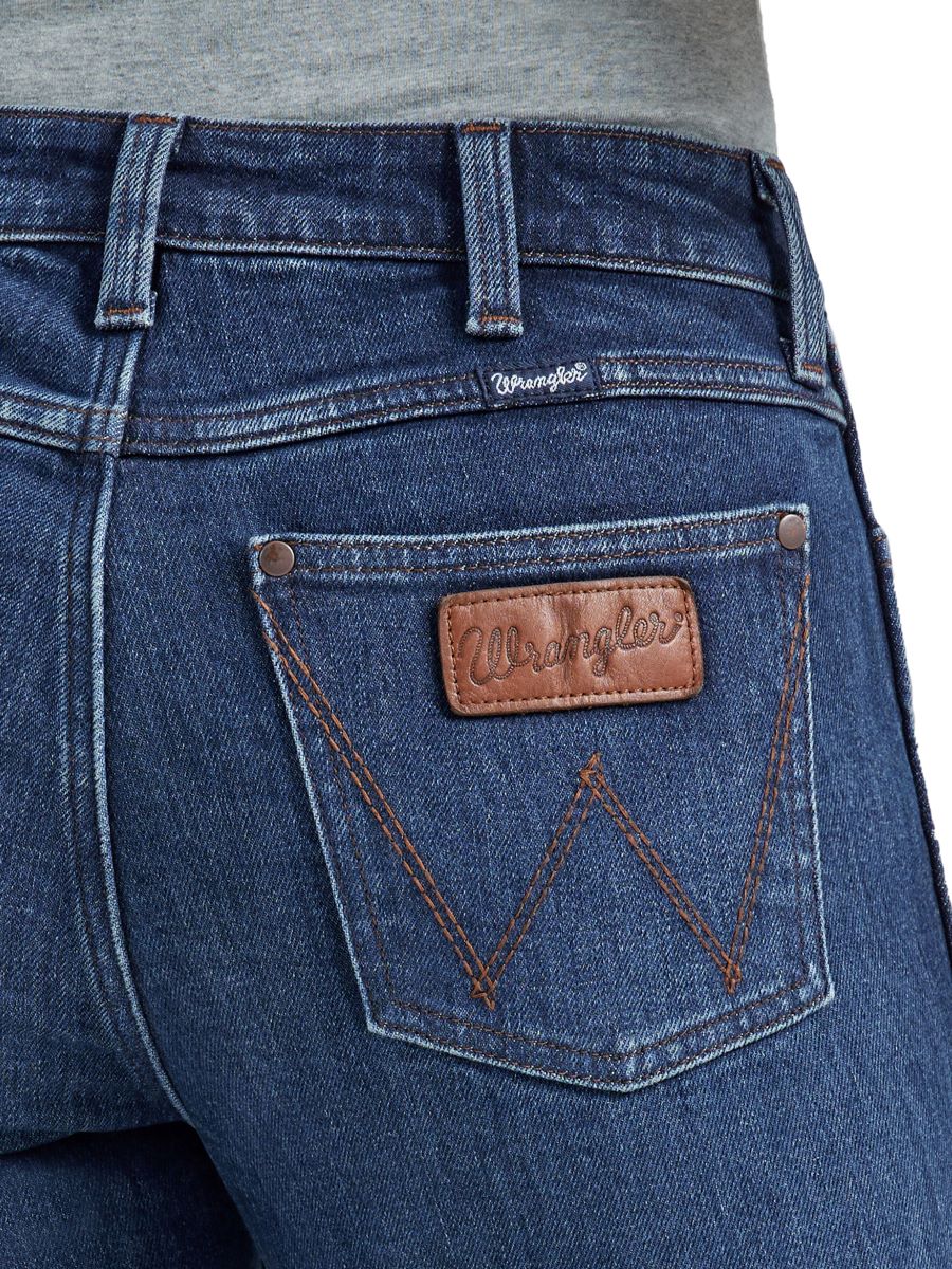 Close-up of Wrangler jeans with brand logo on pocket