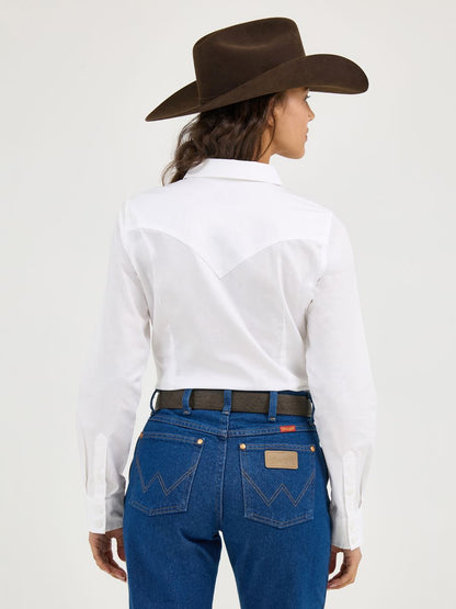 Woman wearing a white Wrangler shirt, blue jeans, and a brown cowboy hat on a white background