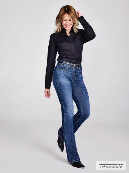 Woman wearing blue jeans and a black shirt on a white background
