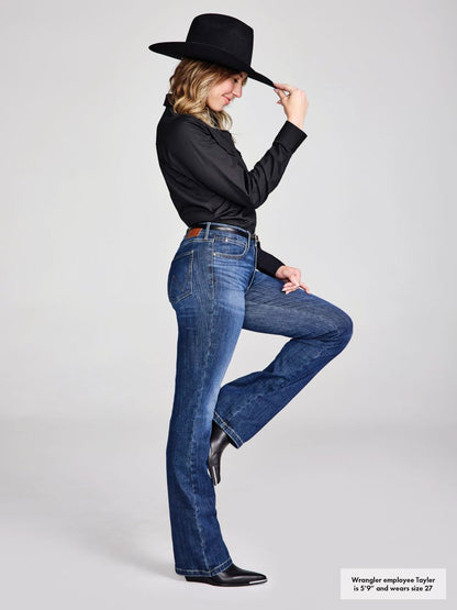 Woman wearing blue jeans and a black hat on a white background