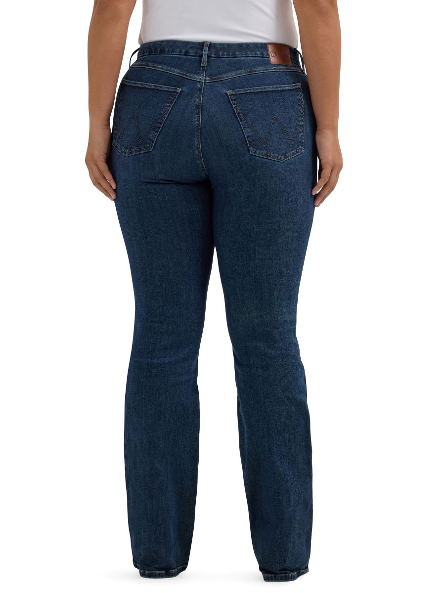 Blue jeans worn by a person on a white background