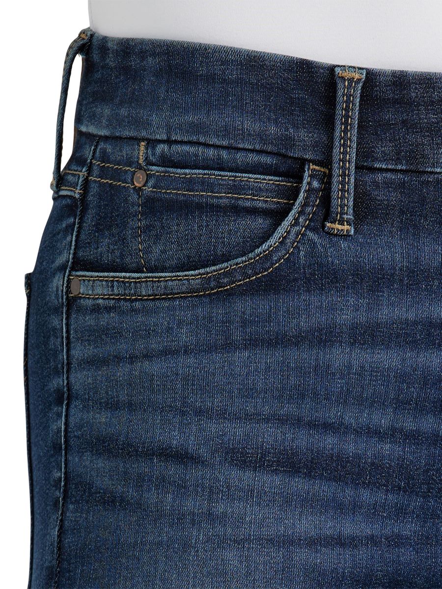 Close-up of blue jeans with a focus on the waistband and pocket.