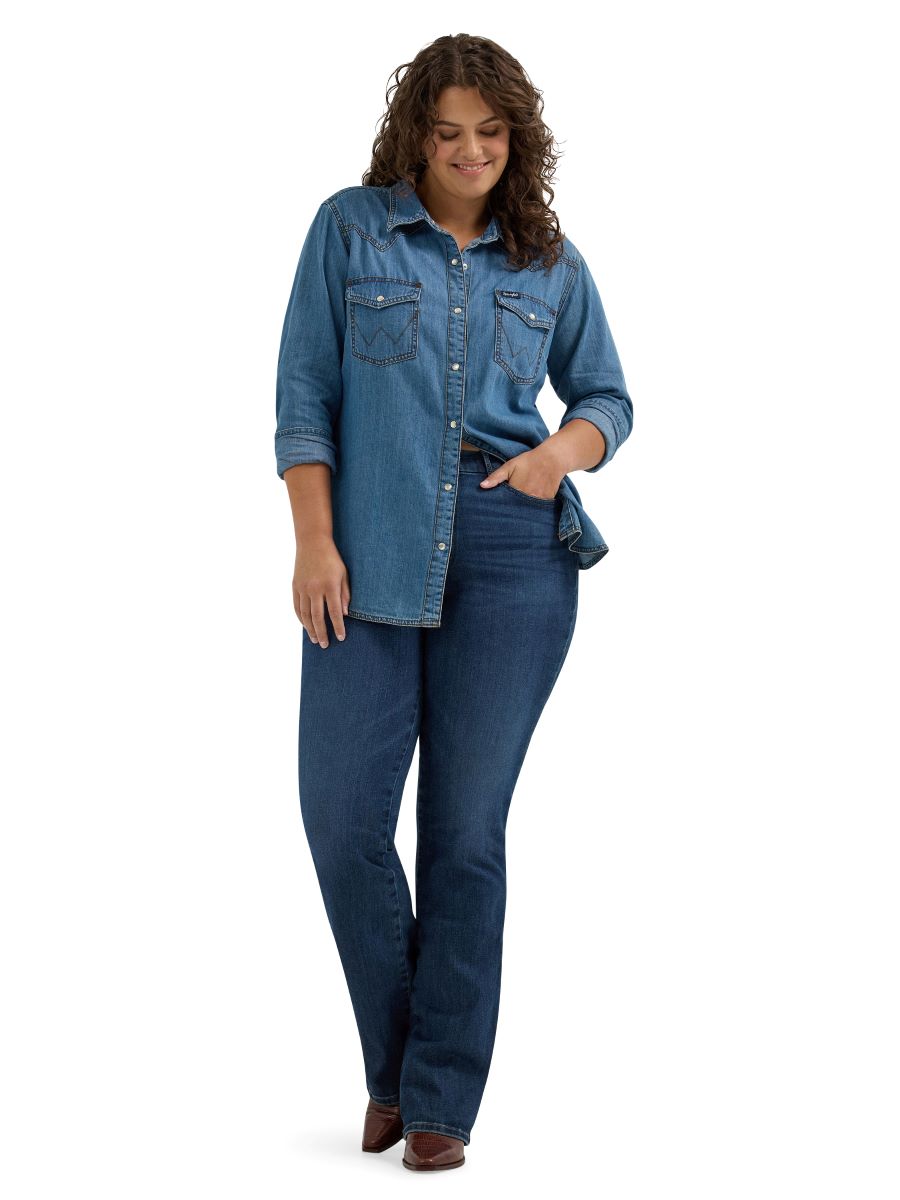 Woman wearing a denim jacket and jeans on a white background