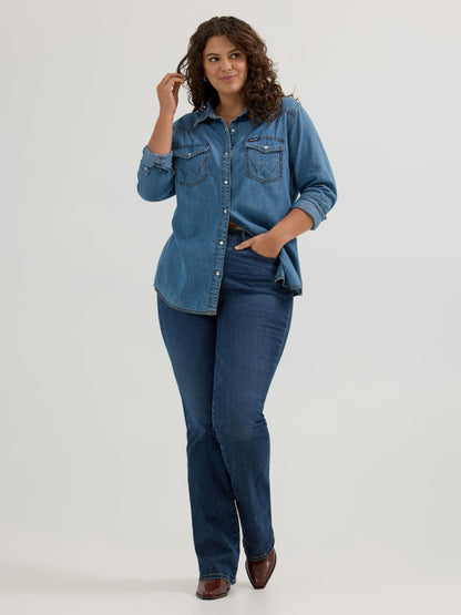 Woman wearing a denim shirt and jeans on a white background