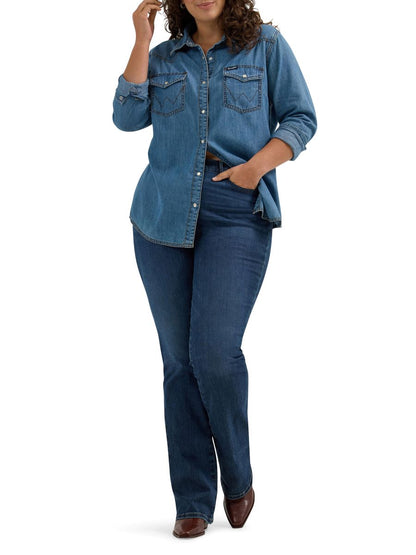 Woman wearing a blue denim shirt and jeans on a white background