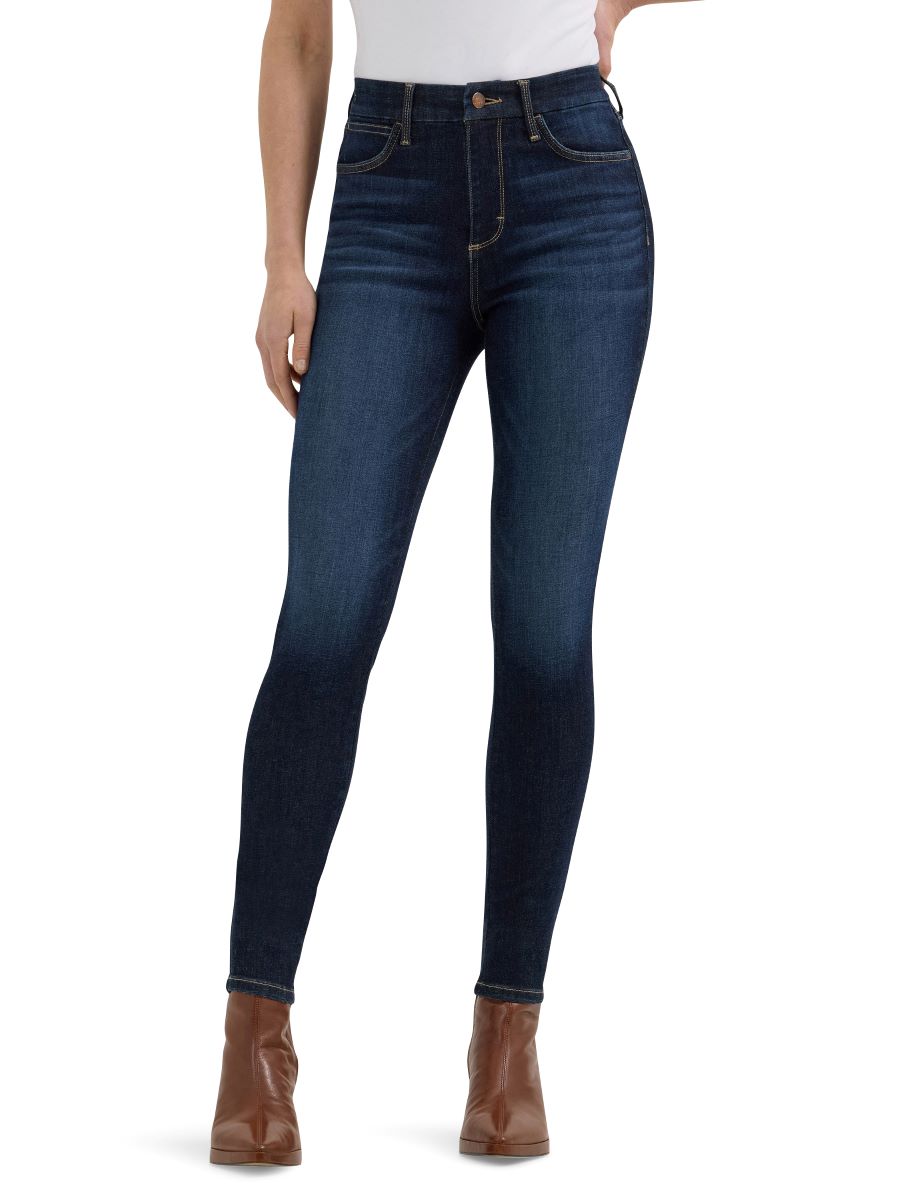 Dark blue jeans worn by a person on a white background