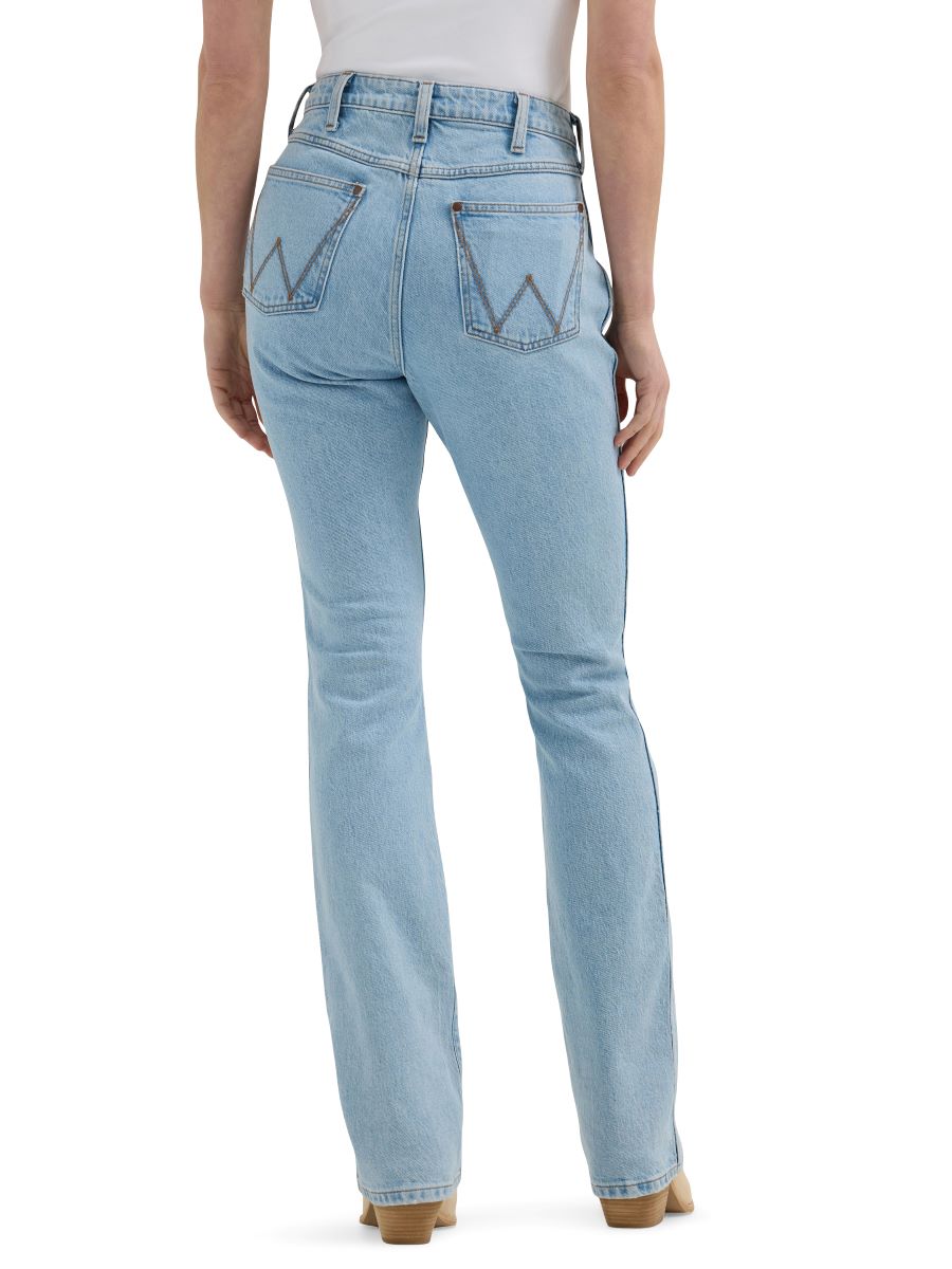 a back view of a pair of lightwash ladies 'bailey wranglers on a white background