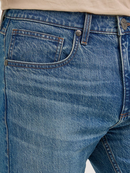 Close-up of blue Wrangler jeans with a focus on the pocket and stitching.