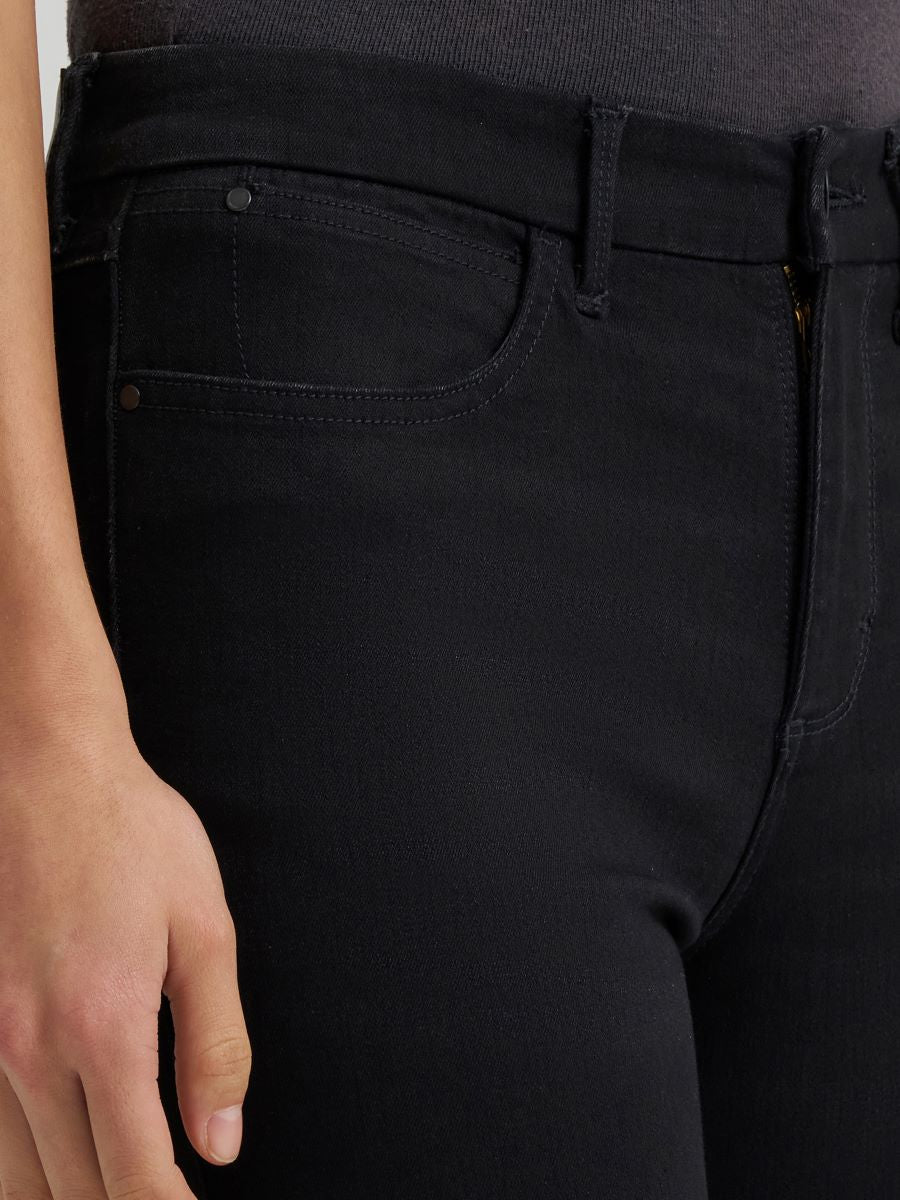 a close up of a pair of black bespoke jeans